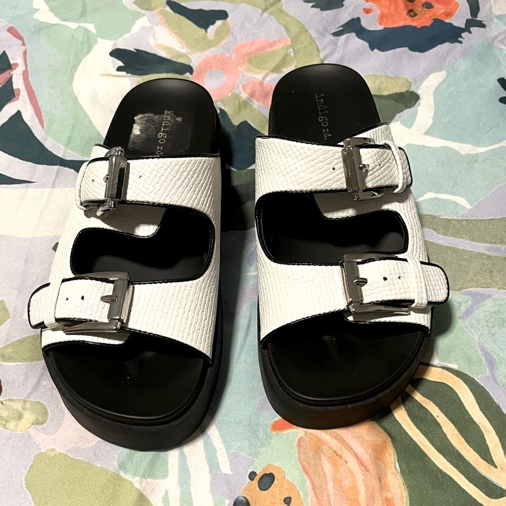 Indigo rd.  White sandal with black trim